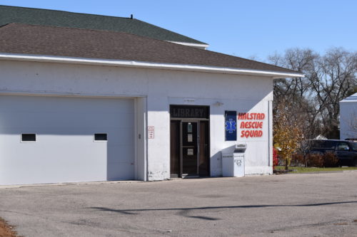 Halstad Library Link Site building with a Halstad Rescue Squad sign outside