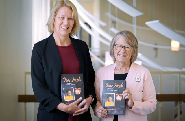 Joy Baker and Patty Wetterling holding copies of "Dear Jacob"